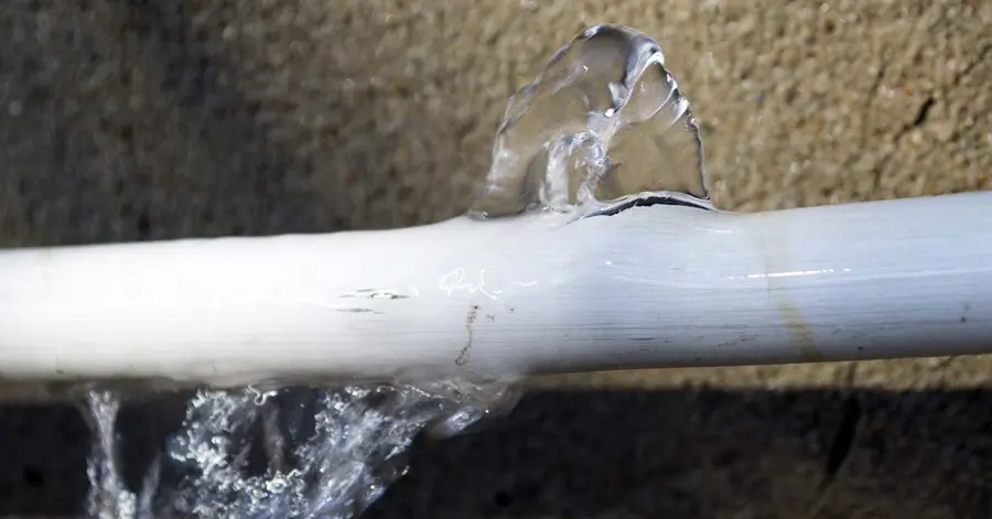 Water spraying from a burst pipe causing water damage in Agoura Hills, CA