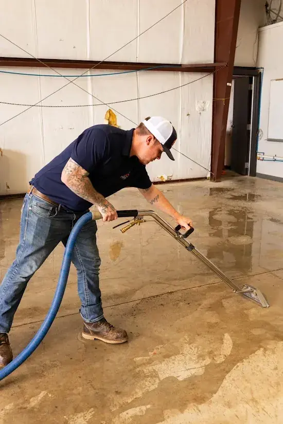 Technician drying a slab floor after a slab leak in an Agoura Hills, CA home